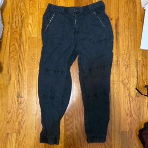 cargo like pants, softer material than cargo, cinched at the ankles